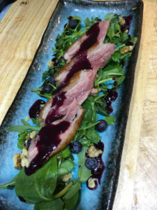 Pigion rocket walnuts blueberries and bluberry coulet Pigion rocket walnuts blueberries and bluberry coulet